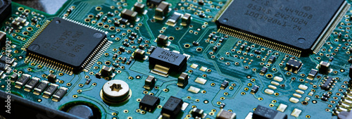Macro Close up of components and microchips on PC circuit board photo