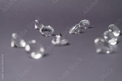 Diamonds out of Glas on a grey Background photo
