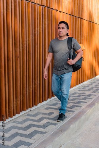 Aboriginal man outdoors with backpack © Hector Pertuz