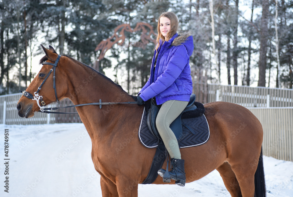 Young girl with horse on winter forest road Young girl with horse on winter forest road