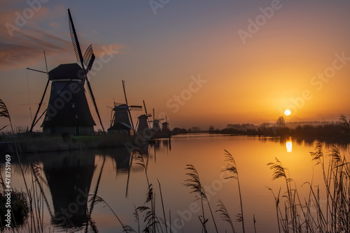 dutch windmill at sunrise