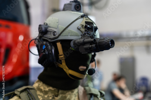Mannequin in army uniform and equipment. Safety helmet and goggles. Special radio communication device. Modern warfare facilities.