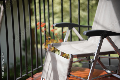 Canvas deck chair on terrace balcony