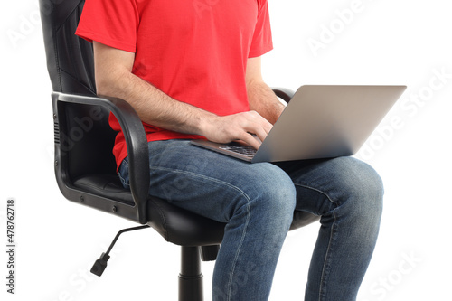 Man with laptop sitting on chair, isolated on white background. Hemorrhoids concept