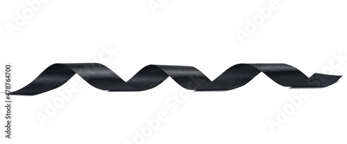 Fotografie swirling black silk ribbon on white background, gift wrapping decor