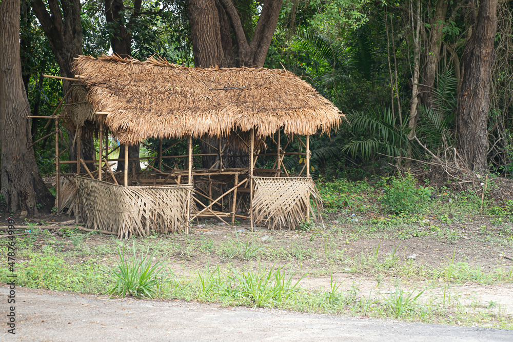 A straw hut without walls on the edge of the jungle. Selective focus points A straw hut without walls on the edge of the jungle. Selective focus points