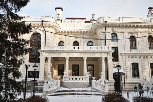 Beautiful rich, white merchant's house, old manor with columns and stucco, estate of Aseev. Built in 1904. Tambov, Russia. photo