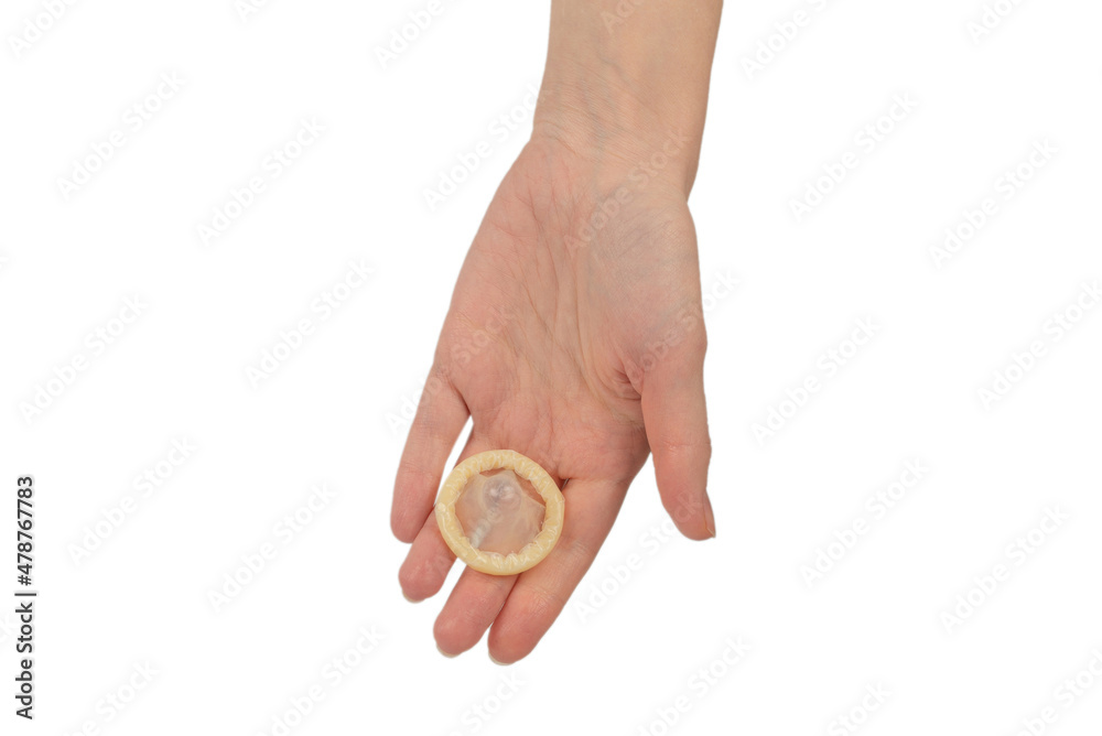 Condom in woman hand isolated on white background. Condom in woman hand isolated on white background.