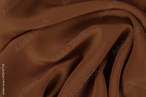 Golden silk or satin luxury fabric texture can use as abstract background.