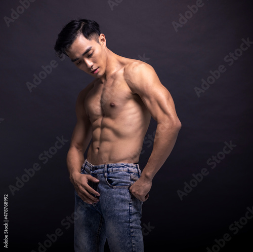 Asian Strong Athletic Man Fitness Model Torso showing six pack abs
