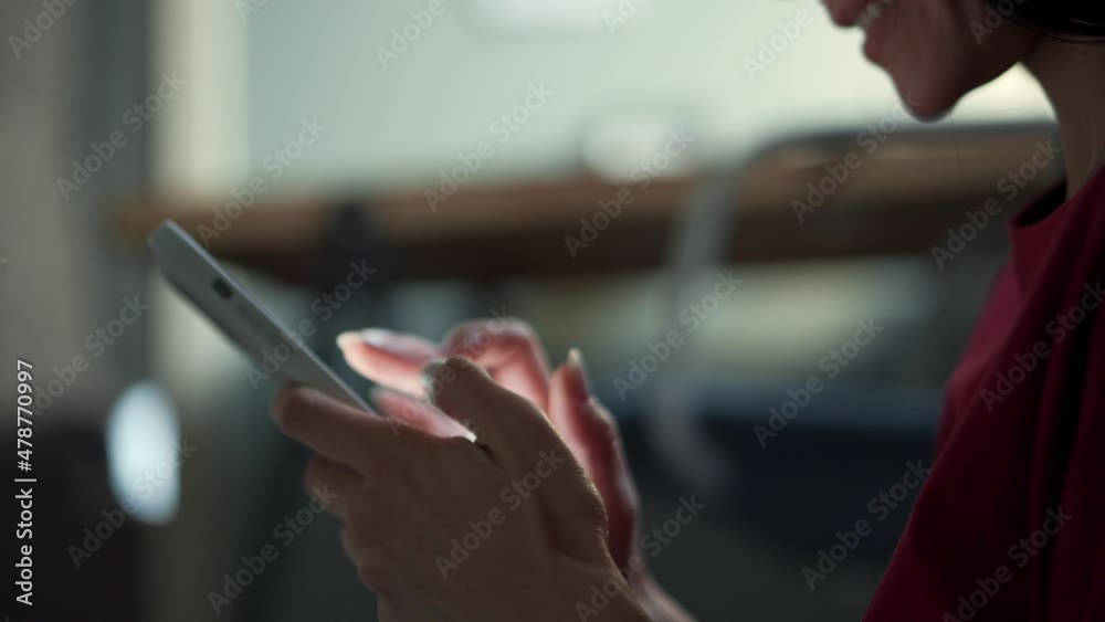 Happy woman texting by phone at home Happy woman texting by phone at home
