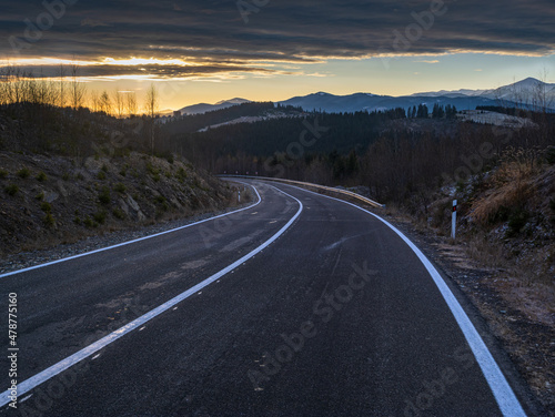 Asphalt road curve and autumn sunset Mountains, Ukraine, Carpathian.