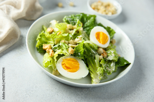 Healthy green salad with cashew and hard boiled eggs 