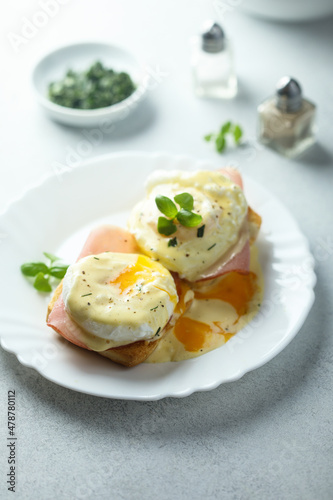 Traditional homemade Benedict eggs with ham