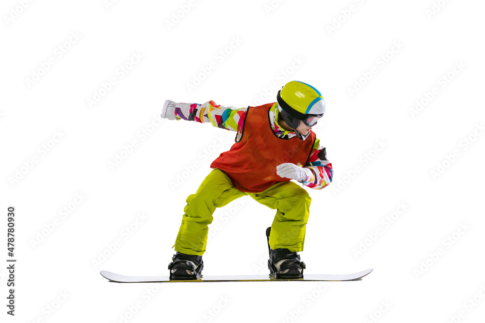 Obraz premium Portrait of young woman in bright sportswear, goggles and helmet snowboarding isolated on white studio background. Concept of winter sports