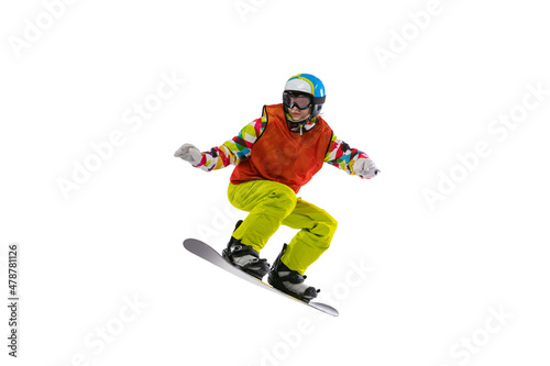 One young woman in bright sportswear  goggles and helmet snowboarding isolated on white studio background. Concept of winter sports