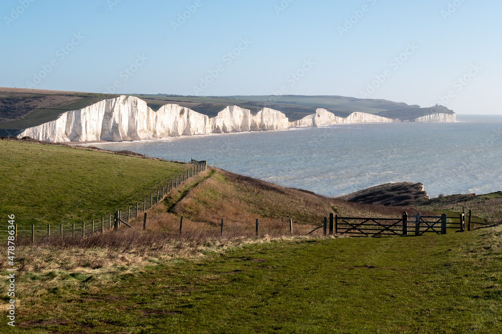 View of the Seven Sisters chalk cliffs facing the English Channel at Seaford, East Sussex on the south coast of England UK. Photographed at Hope Gap.