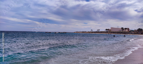 View of Abu Dabab beach and bay in Egypt. Waves in the Red Sea. Blue water and sky 