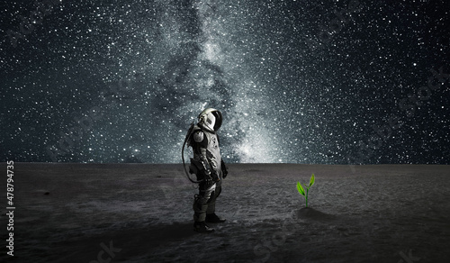 Fotografie, Obraz Silhouette of  astronaut at night background