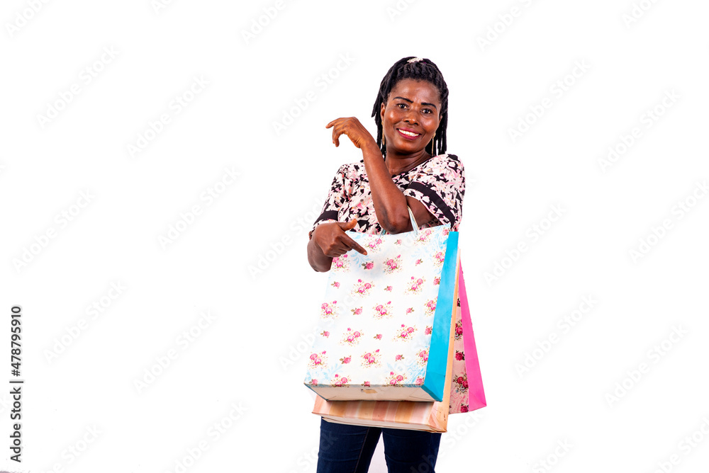 beautiful mature woman with shopping bags smiling. beautiful mature woman with shopping bags smiling.