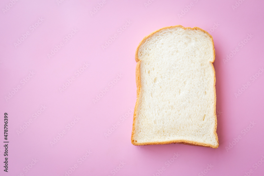 Thin sliced bread on pink background.