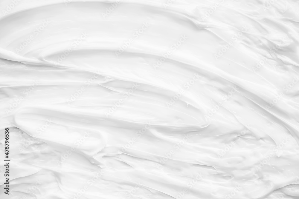 White surface of the cream lotion softens the background.