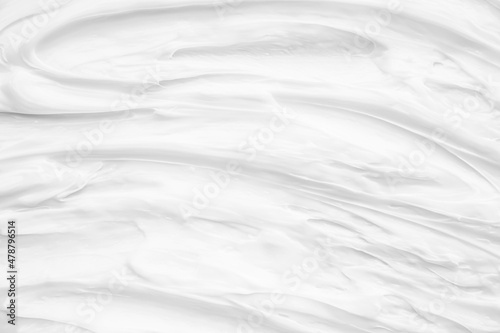 White surface of the cream lotion softens the background.