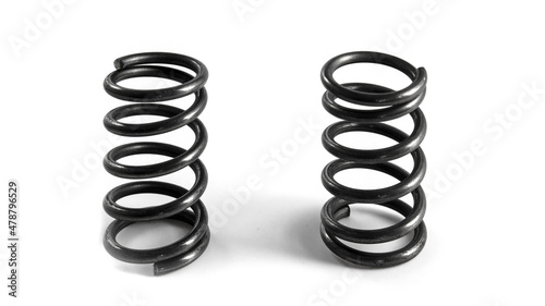 2 car springs on a white background. Isolated spare parts for vehicle repair.