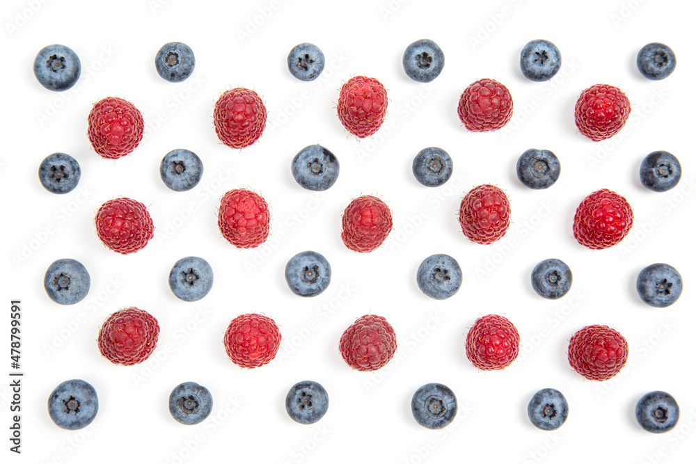 raspberries and blueberries on a white background. Vitamins and wholesome foods