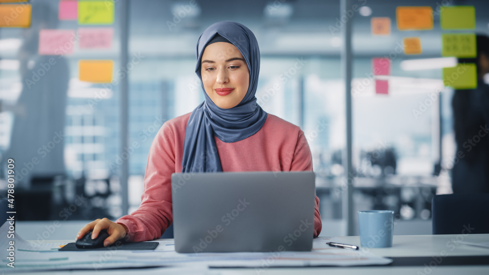 Free Photo  Attractive female arabic working on laptop computer and  paperworks on desk arabian businesswoman working at home dedication and  technology essential for getting her tasks done