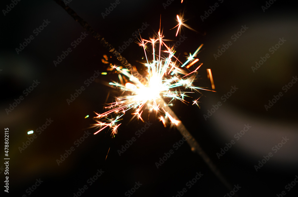Burning sparkler background. Christmas banner with copy space. Christmas eve.