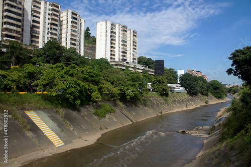 Traveling through the city canals of the Guaire river, its waters are waste and accumulate all the wastes of the industry and the Caracas population photo