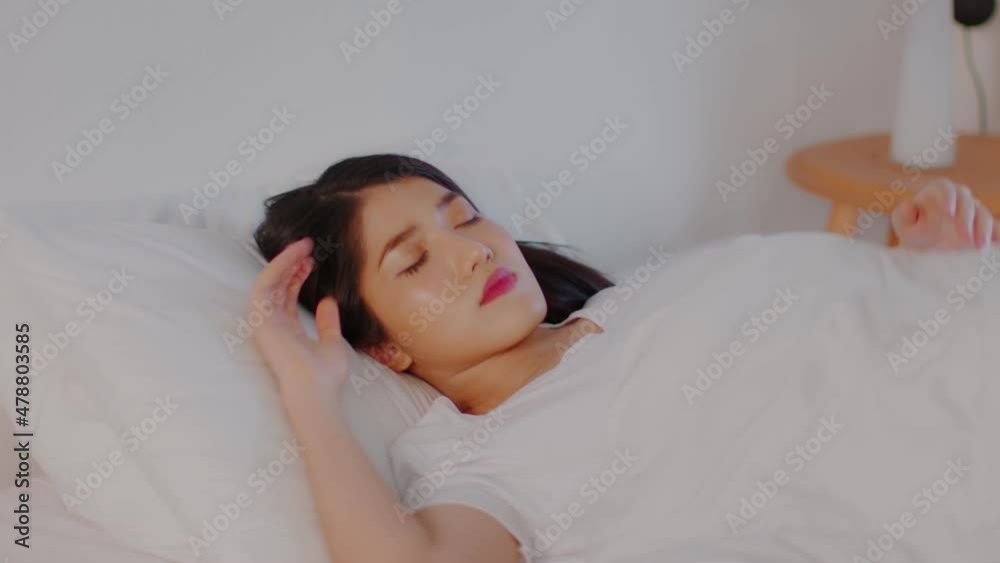 Beautiful Attractive Asian woman sleep and sweet dream lying on bed in cozy bedroom in the morning feeling so relax and comfortable,Healthcare Concept Beautiful Attractive Asian woman sleep and sweet dream lying on bed in cozy bedroom in the morning feeling so relax and comfortable,Healthcare Concept
