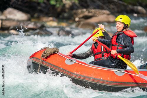 Girl are rafting in river. Extreme sports, water activity and adrenaline concept. © Jon Anders Wiken