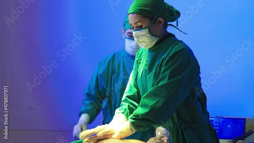 Surgeon assistant with efibrillating in emergency room. Healthcare and medical concept.