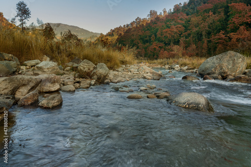 Beautiful Reshi River water flowing through stones and rocks at dawn, Sikkim, India. Reshi is one of the most famous rivers of Sikkim flowing through the state and serving water to many local people. photo
