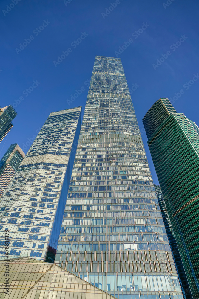 Naklejka premium Skyscrapers in the business center, financial district, sunny day, blue sky, empty space, Moscow city, Russia.