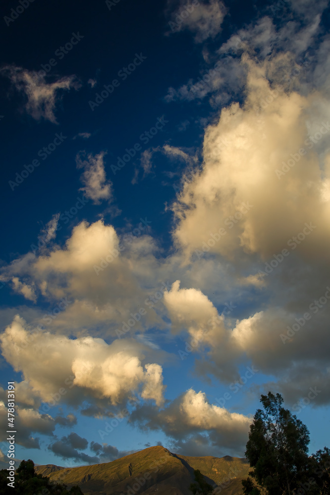 Multiple exposure composite of a group of soft clouds floating over the Iguaque mountain at sunset, near the colonial town of Villa de Leyva in central Colombia.