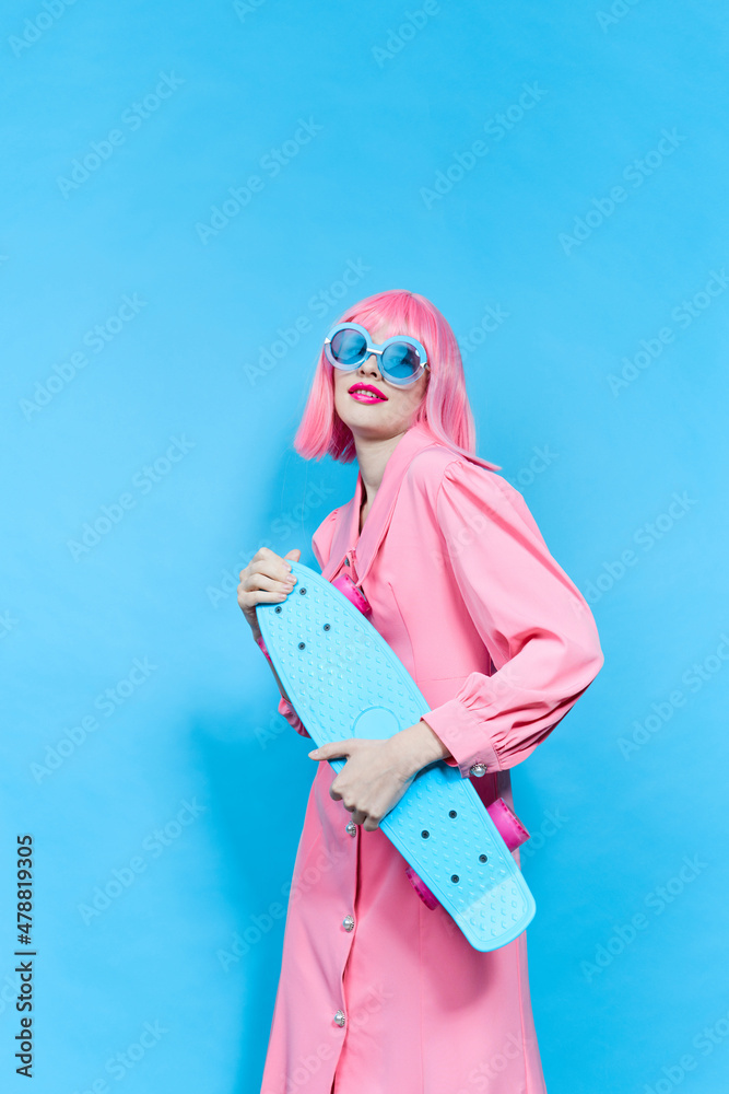 pretty woman in sunglasses wears a pink wig studio model unaltered pretty woman in sunglasses wears a pink wig studio model unaltered