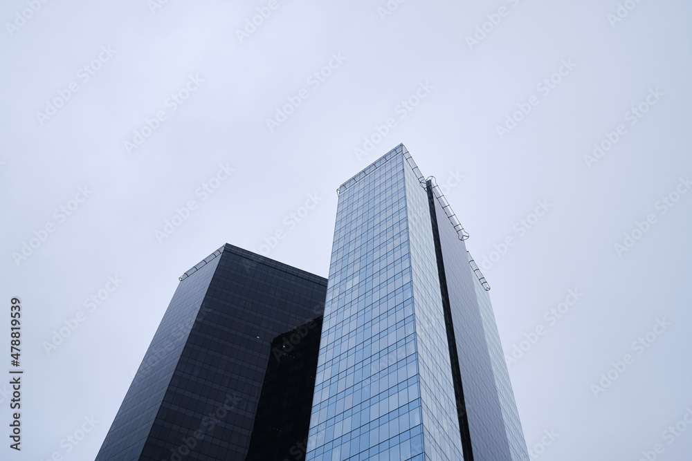 View of modern skyscrapers in the city's business district. Modern glass business buildings in the city center View of modern skyscrapers in the city's business district. Modern glass business buildings in the city center
