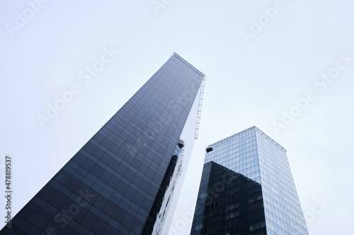 View of modern skyscrapers in the city's business district. Modern glass business buildings in the city center