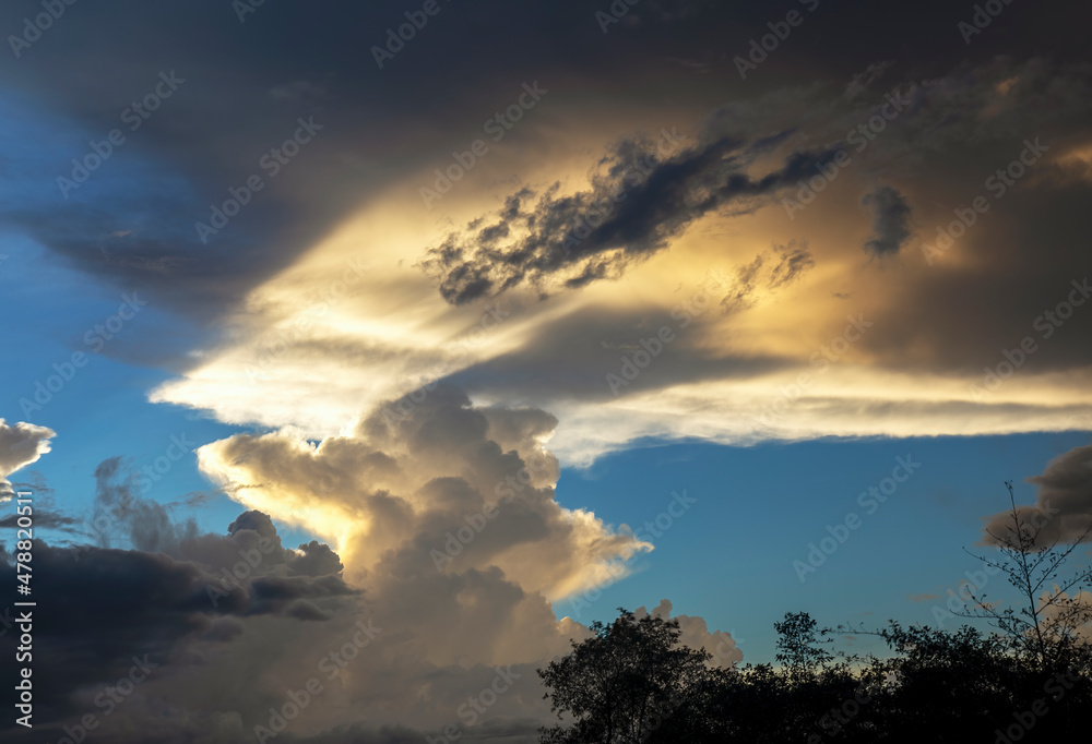 Fototapeta premium Multiple exposure composite of the light and the shadows over the clouds at sunset, near the colonial town of Villa de Leyva in central Colombia.