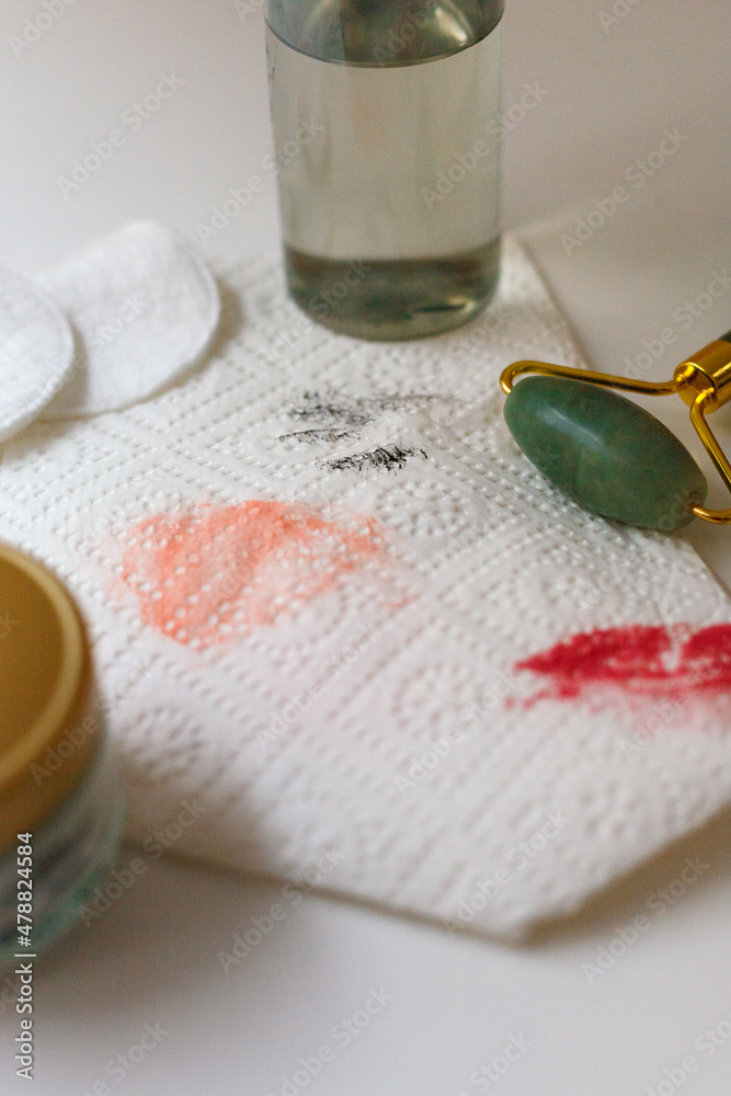 Evening make-up removal - micellar water, jade roller, cream, cotton pads - obrazy, fototapety, plakaty 