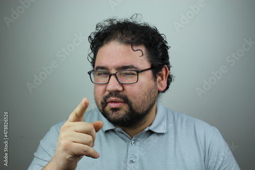 it is your turn concept. Winking man points his finger to camera.