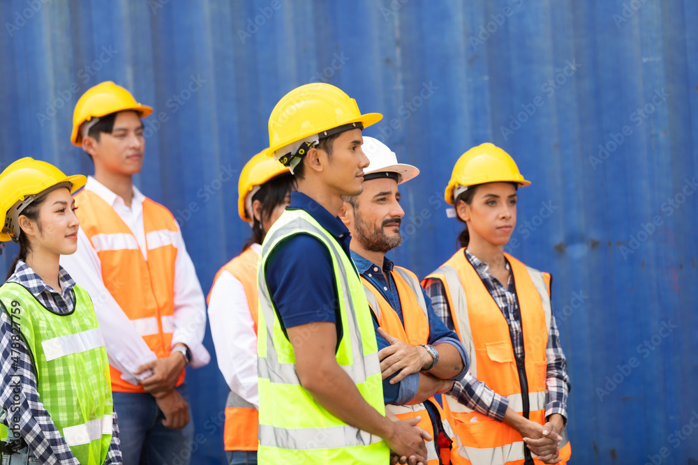 Group of Ethnic diversity people, Business Success teamwork concept. Group professional dock worker and engineering wearing hardhat safety helmet and safety vest working at container yard port