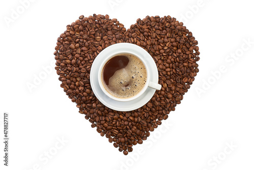 Heart shape from coffee beans with cup of coffee on white