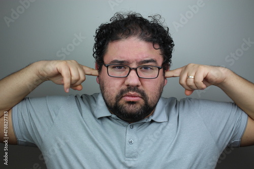 tired unhappy young man does not want to hear anything