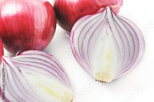 red onion bulbs on a white background