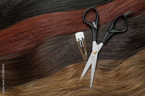 Female hair, hair clip and scissors, close up