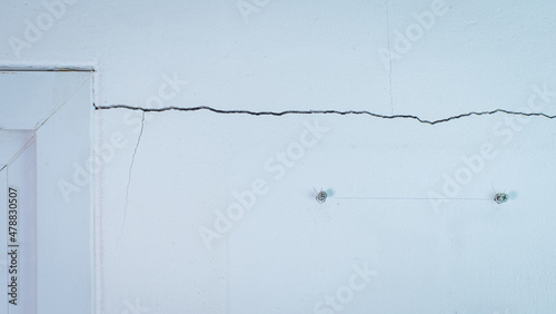 Cracks on the wall. The cra...